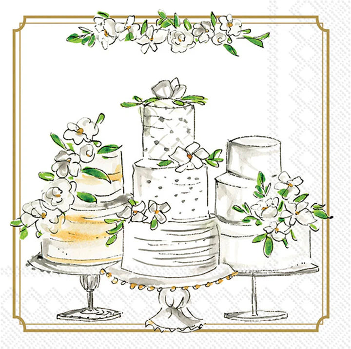 Cocktail napkin design featuring watercolor-style wedding cakes on pedestal stands with white floral decorations, greenery accents, and an elegant gold border.