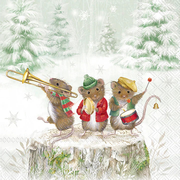 Paper cocktail napkins showing a festive holiday illustration of three adorable mice dressed in winter clothes playing musical instruments—trombone, tambourine, and drum—while standing on a snowy tree stump with a pine forest background.