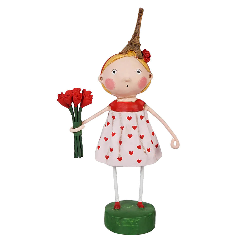 A resin figurine of a whimsical character holding a bouquet of red tulips, with a pink dress featuring heart patterns and a green base.