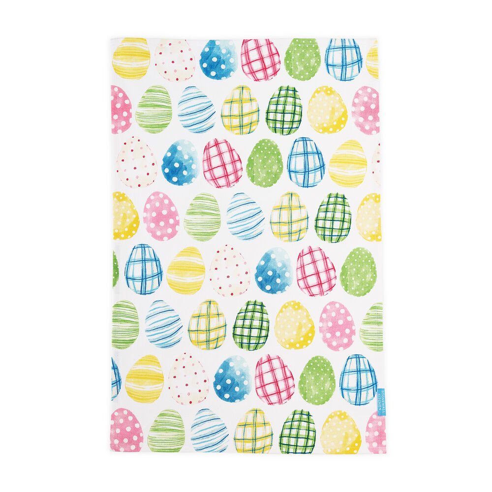A multicolored tea towel with a pattern of Easter eggs in various designs such as checkered and dotted, on a white background.