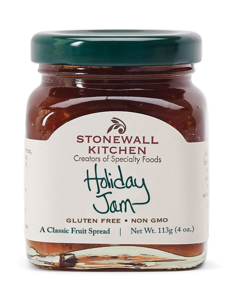 A jar of Stonewall Kitchen Holiday Jam with a label indicating it is gluten free and non-GMO. The jam is presented as a classic fruit spread.
