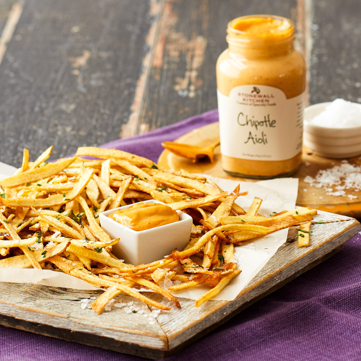 photo is a plate of french fries with a bowl of Stonewall Kitchen Chipotle Aioli for dipping